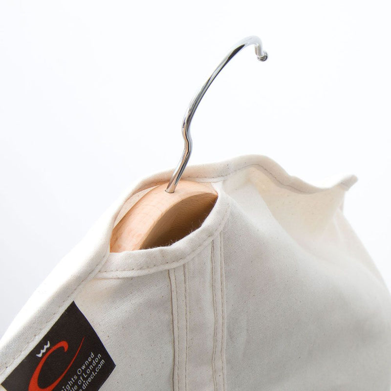 Natural 100% Cotton Cover from Caraselle on a hanger 